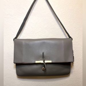Grey Celine shoulder bag with gold accents.